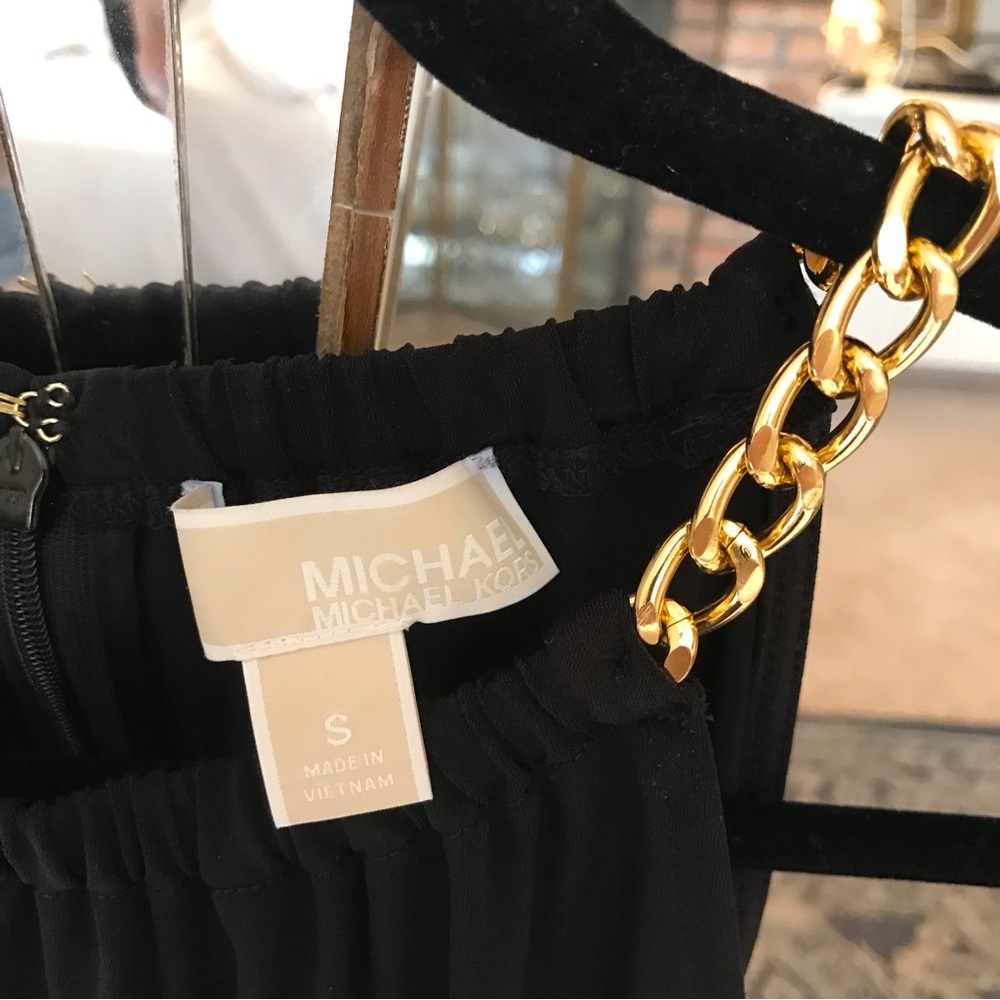 Michael Kors Black Halter Jumpsuit with Gold Chain Neckline Detail.